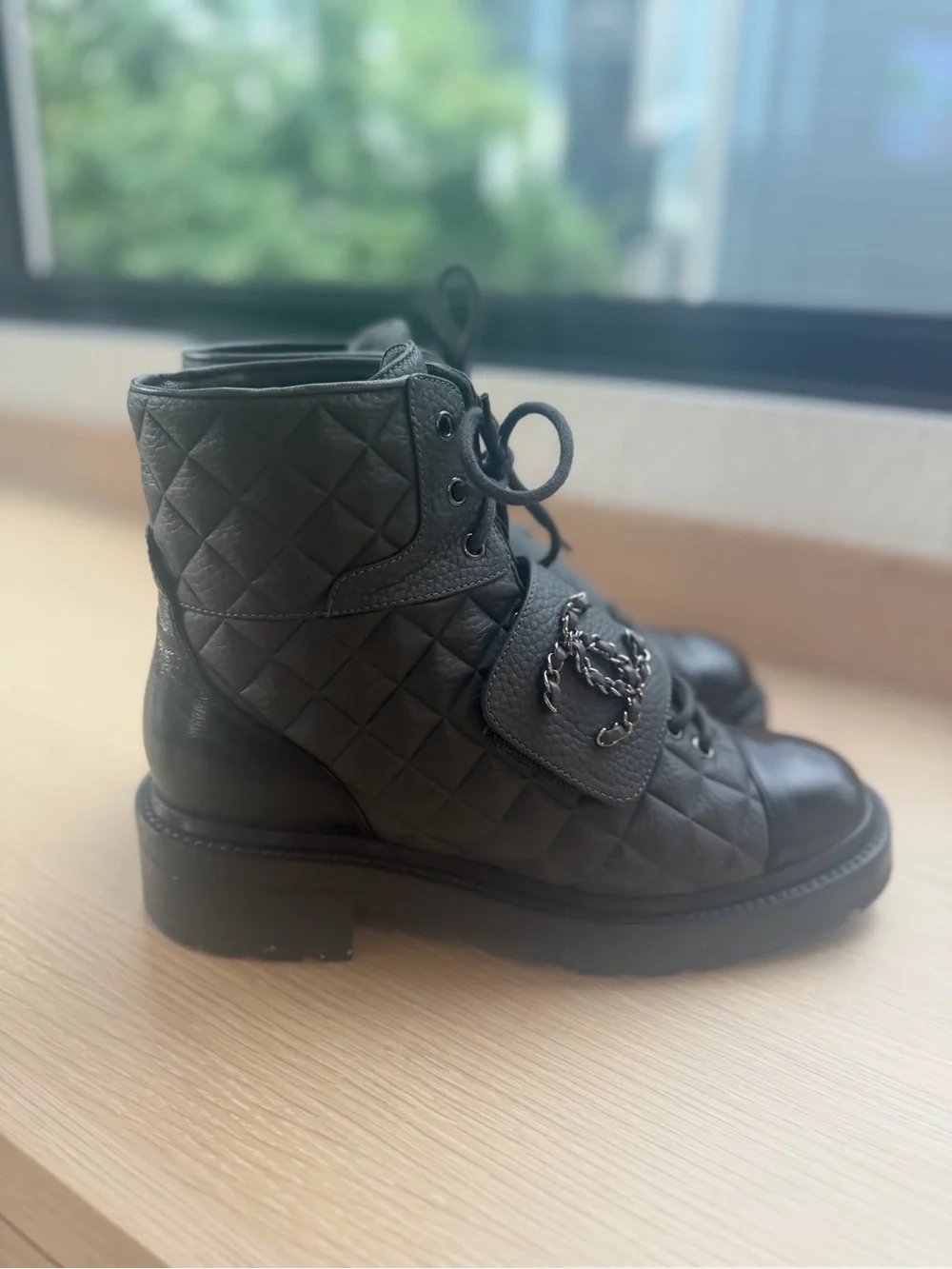 CHANEL Black Quilted Leather Combat Boots with Patent Toe